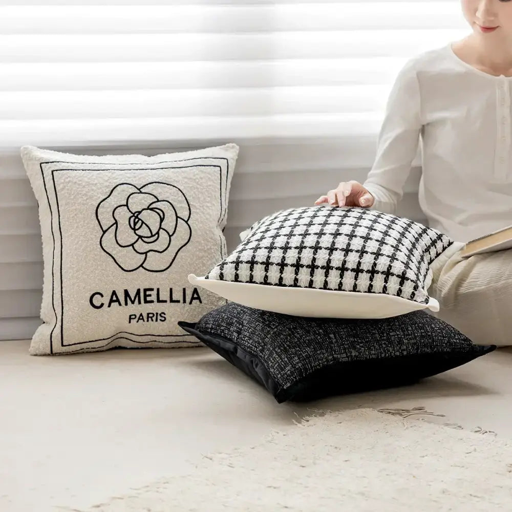 Luxury cream pillow cover with black embroidered camellia and textured border decorbites camellia jacquard design