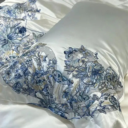 Luxury cream satin pillowcase with intricate blue decorbites butterfly flowers embroidery in a bedding set