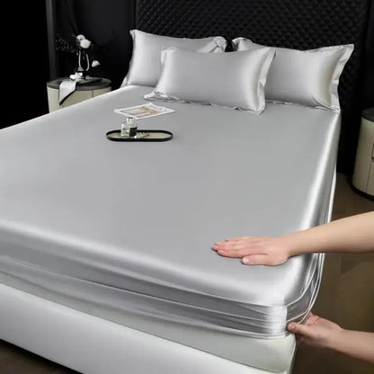 Luxury cream mulberry silk fitted sheet set with smooth silver satin fabric and neatly folded edges for bedroom use