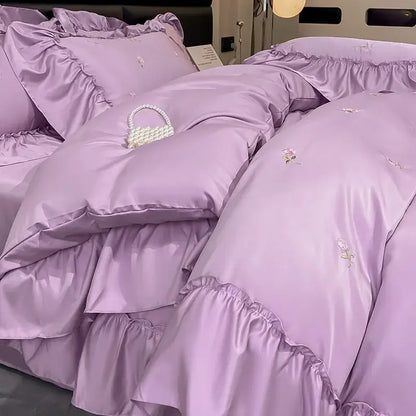 Lavender satin bedding set with delicate floral embroidery and ruffled edges from luxury cream and pink ice silk bedding sets by decorbites ice silk