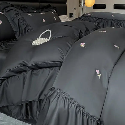 Black satin bedding set with delicate floral embroidery and pearl-embellished basket motif in decorbites ice silk style