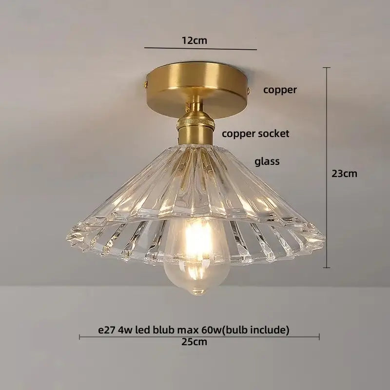 A clear faceted crystal glass luxury ceiling light with brass copper finished mounting base for bedroom decorbites decor