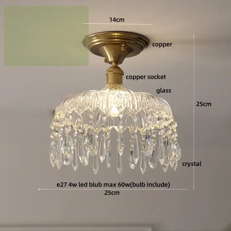A clear crystal glass luxury ceiling light with brass copper fixture and teardrop decorbites crystal glass elements