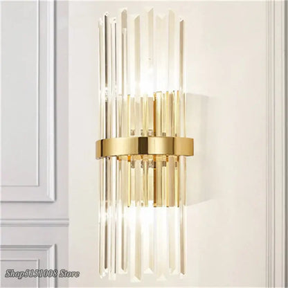 Luxury decorbites crystal golden wall lamp featuring gold-toned metal and vertical crystal rods for elegant bedroom decor