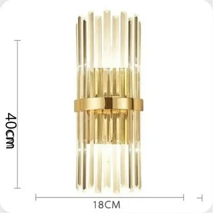 Luxury crystal golden wall lamp featuring gold-toned sconce with vertical crystal rods and central metallic band for decorbites crystal golden decor