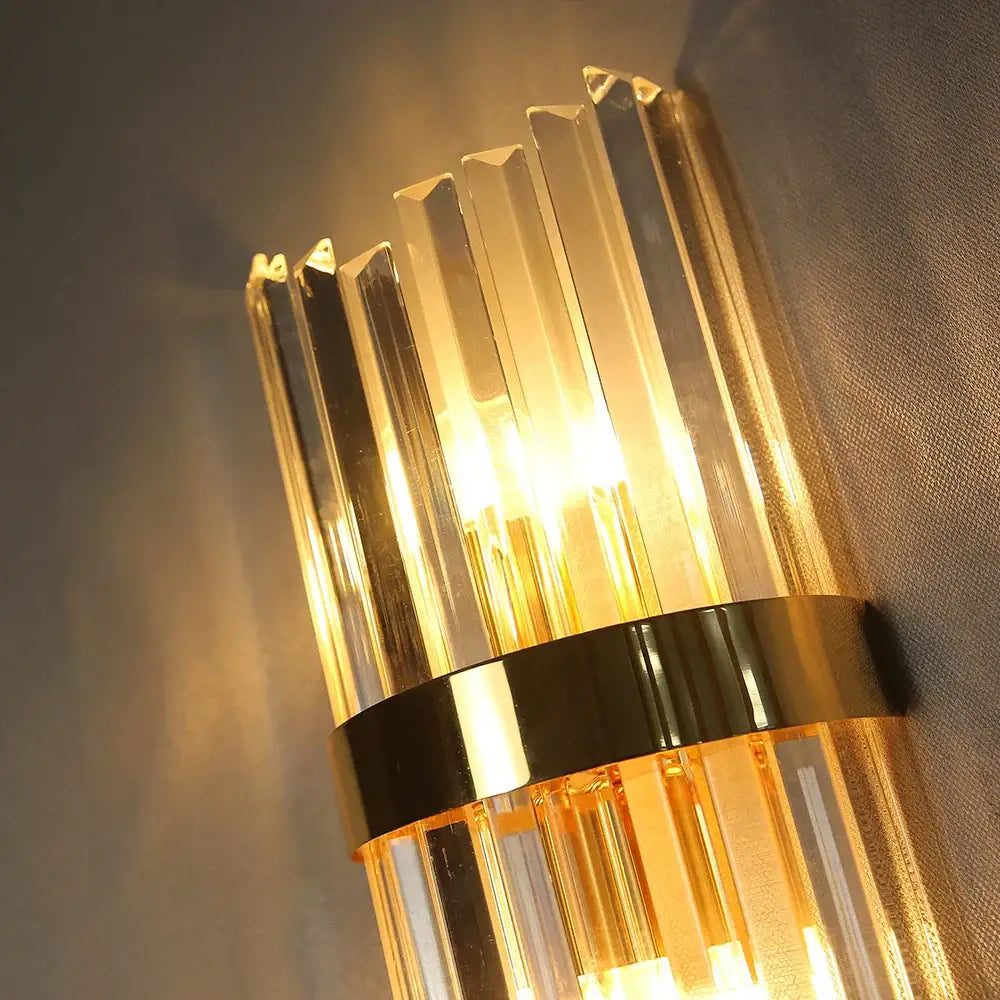 Luxury crystal golden wall lamp featuring gold-toned polished brass and faceted crystal columns for elegant decorbites decor