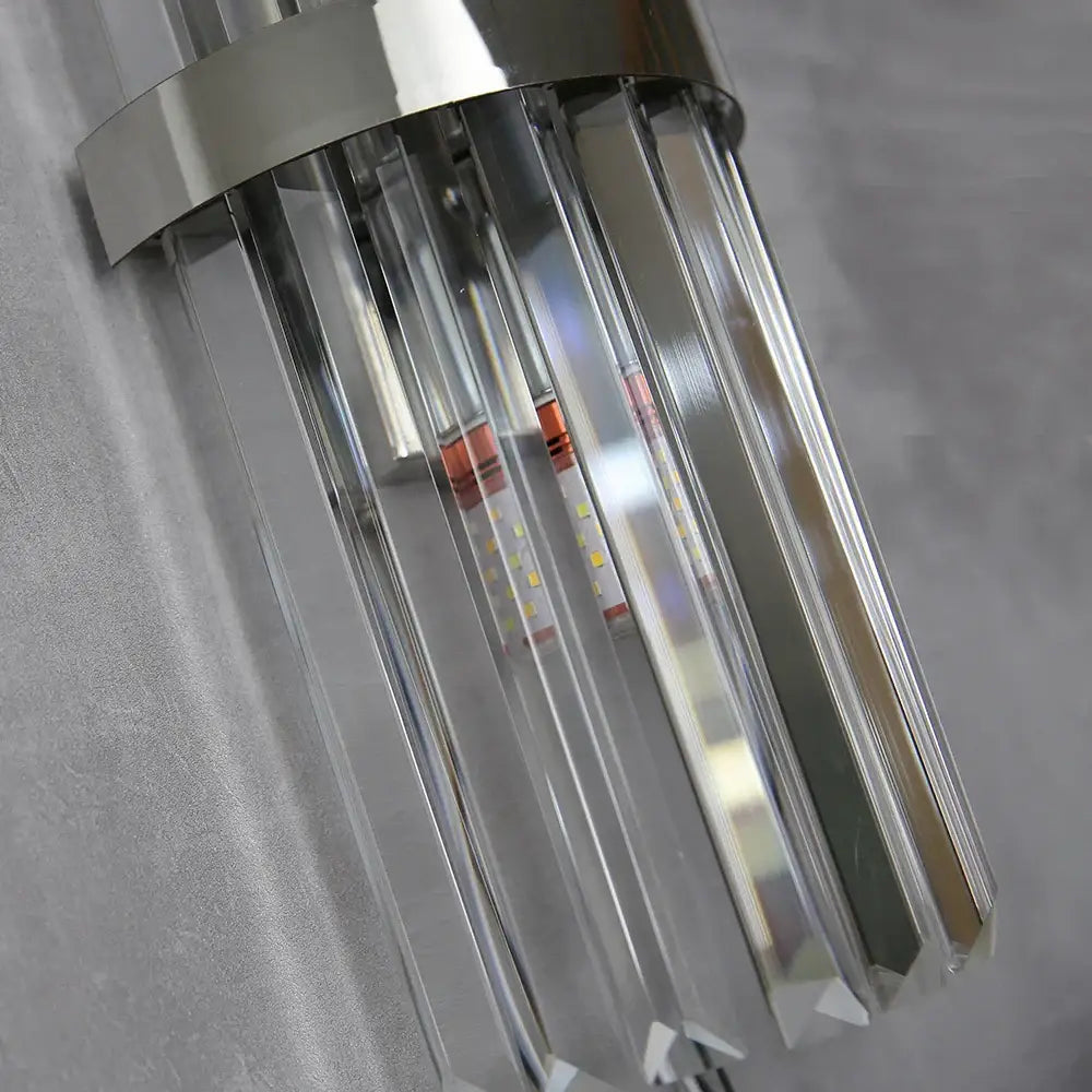Modern crystal golden wall lamp with sleek chrome finish and clear faceted prisms for luxury living room decorbites decor