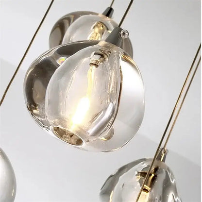 Luxury crystal led chandelier featuring clear hand-blown glass pendant light with warm glow and metallic accents by decorbites crystal led