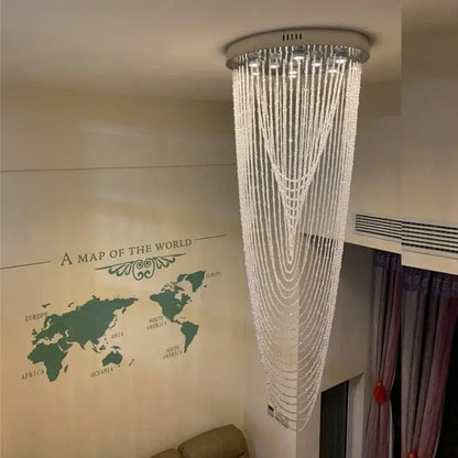 Luxury crystal tassel stair chandelier with cascading clear faceted beads and a sleek silver base for elegant decorbites lighting