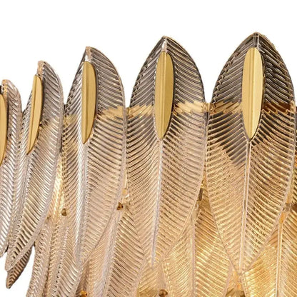 A luxury chandelier featuring decorbites glass leaf design with ribbed glass leaves and polished gold accents for living rooms