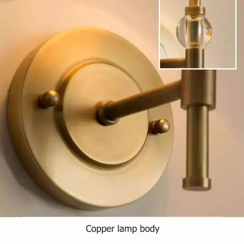 Luxury European brass copper wall lamp with a sleek circular base and clear glass globe for bedroom decorbites copper wall lamp