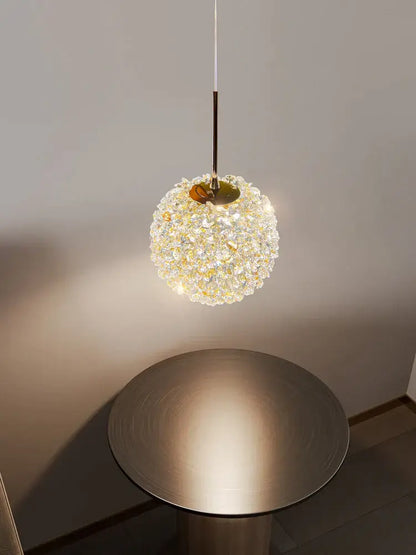 Luxury gold and amber crystal ball pendant light with a golden metal frame and decorbites crystal ball beads