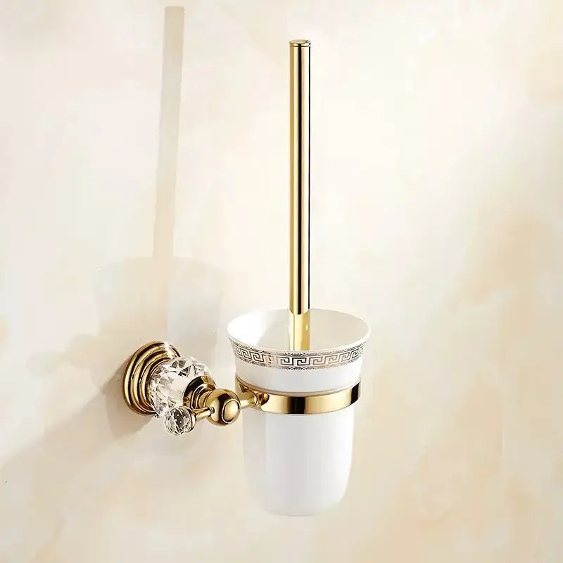 Luxury gold and crystal bath hardware toilet brush holder with white ceramic cup featuring greek key pattern and crystal knob