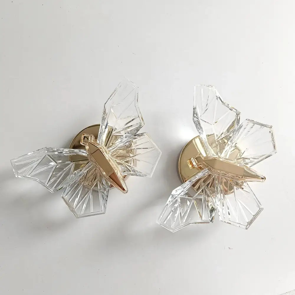 Luxury gold butterfly wall lamp featuring clear crystal butterfly wall sconces with gold-toned metal accents for bedroom lighting