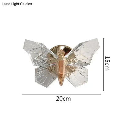 Clear faceted crystal butterfly pin with gold toned center and metallic backing for luxury gold butterfly wall lamp