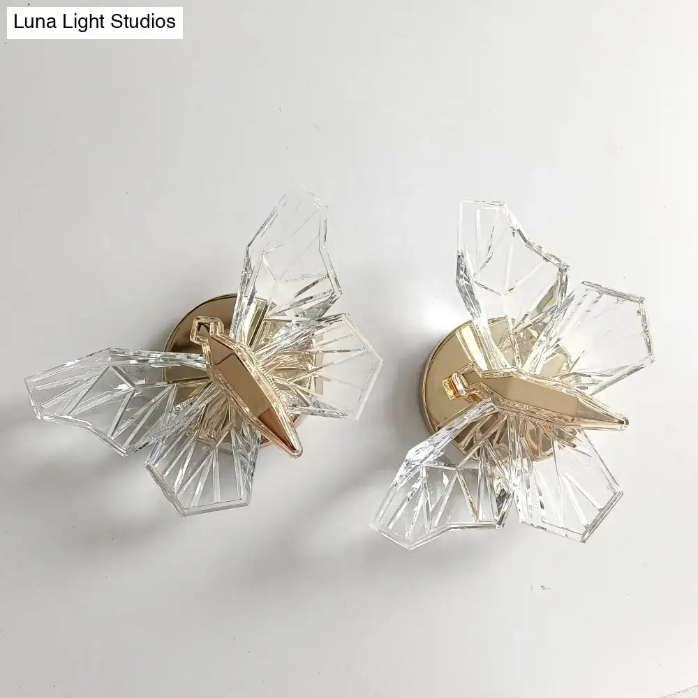 Luxury gold butterfly wall lamp featuring clear geometric crystal design with gold-toned metal accents for bedroom lighting