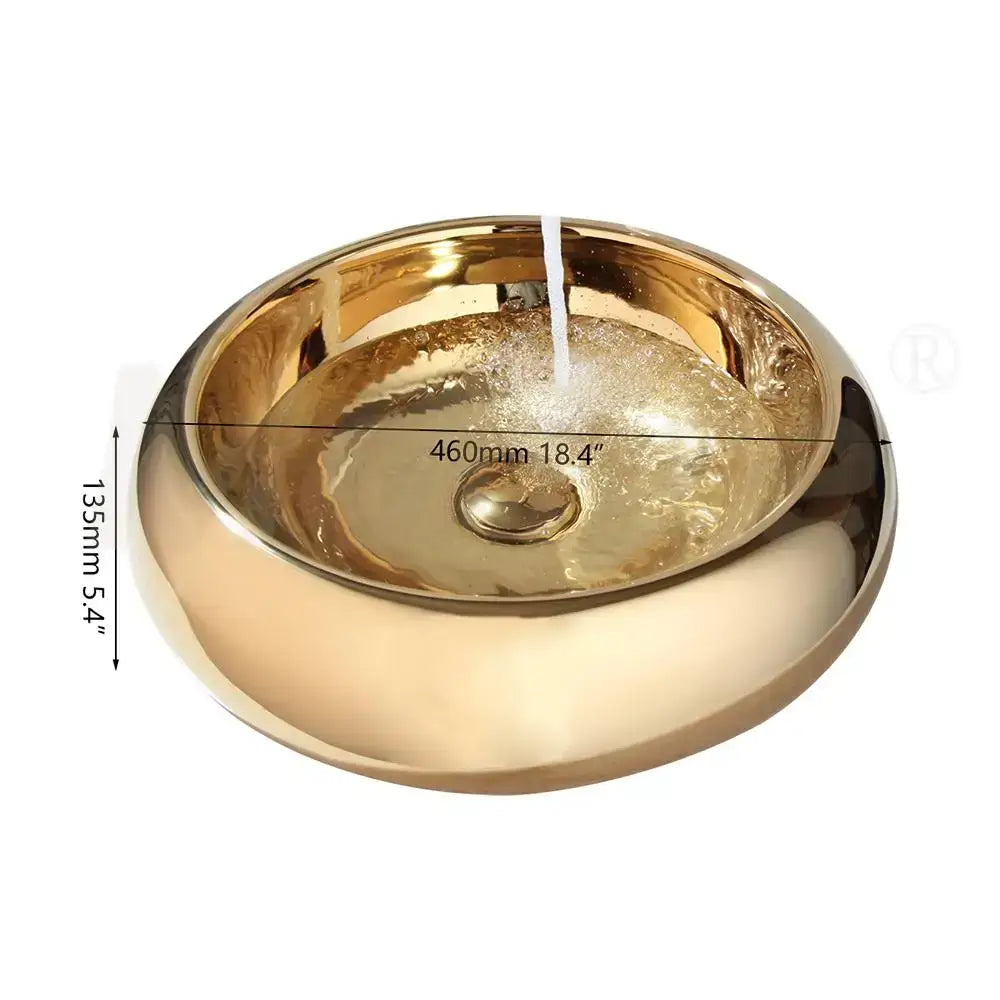 Luxury gold ceramic vessel sink with shiny gold-toned finish and integrated bath mixer set for bathroom use