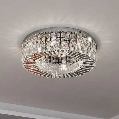 Luxury gold decorbites crystal ceiling chandelier with chrome frame and cascading clear crystal prisms for dining room decor