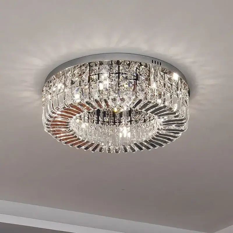 Luxury gold decorbites crystal ceiling chandelier with chrome frame and cascading clear crystal prisms for dining room decor