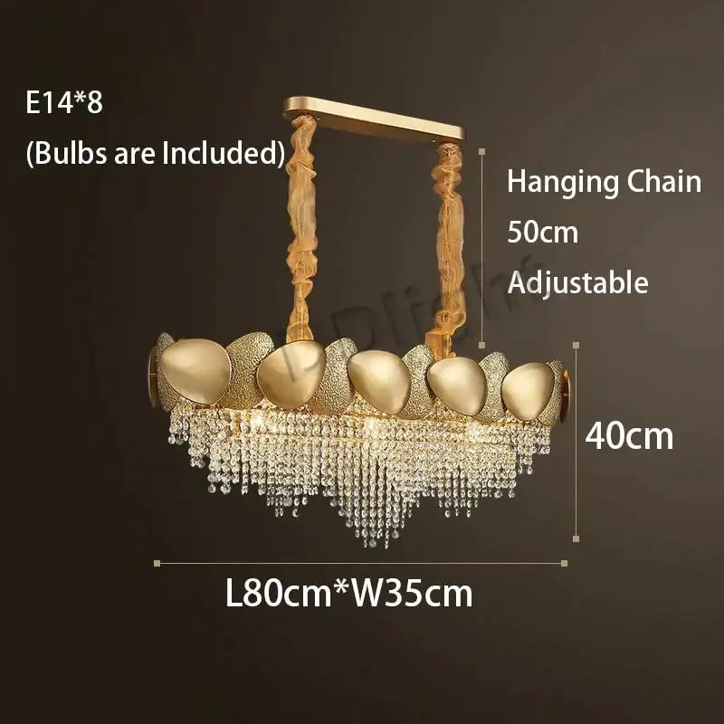 Gold-toned led ceiling chandelier with eight ornate shell-like fixtures and cascading crystal luxury tassels by decorbites