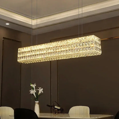 Luxury gold crystal led pendant light featuring a rectangular modern design with faceted crystals for dining room decorbites crystal led