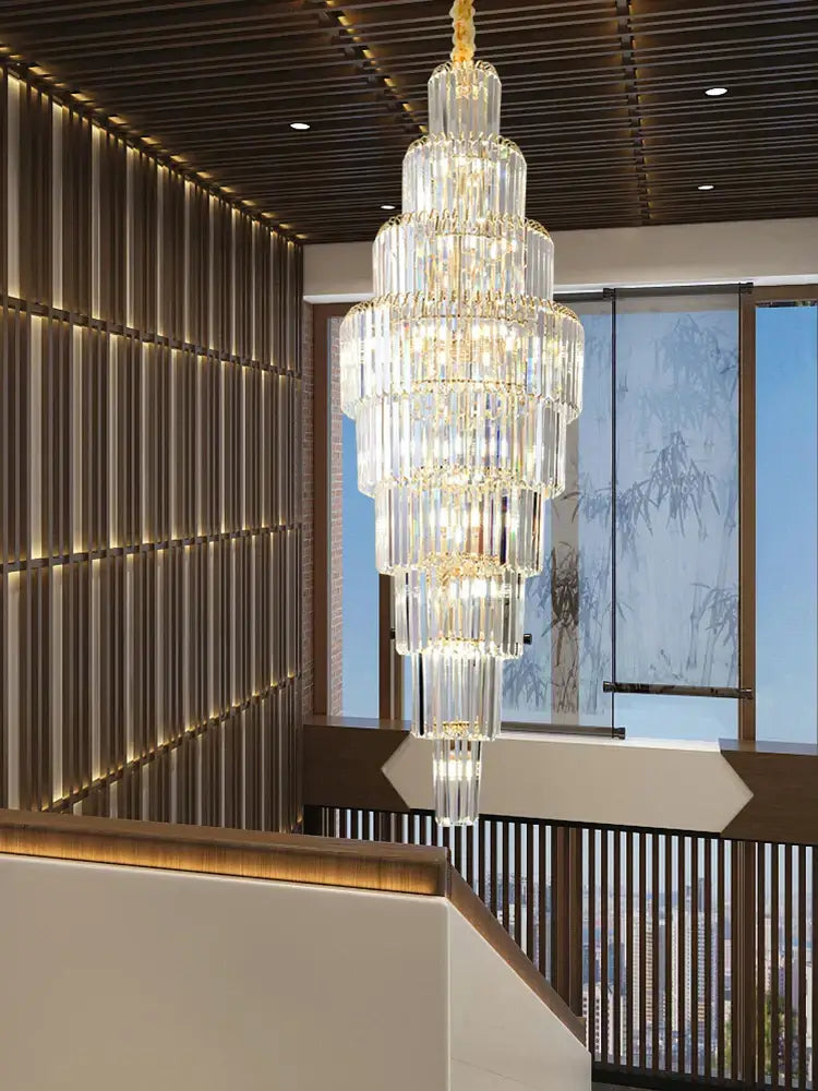 Luxury gold crystal pendant chandelier with cascading cylindrical glass tiers, ideal for hotel lobby decorbites crystal pendant