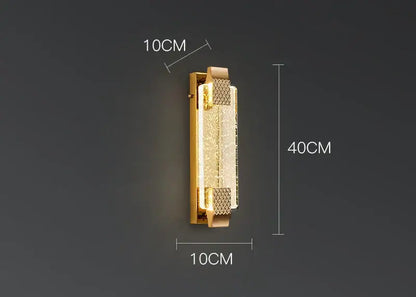 Luxury gold crystal wall lamp featuring a gold-toned rectangular design with textured translucent crystal panel decorbites wall lamp