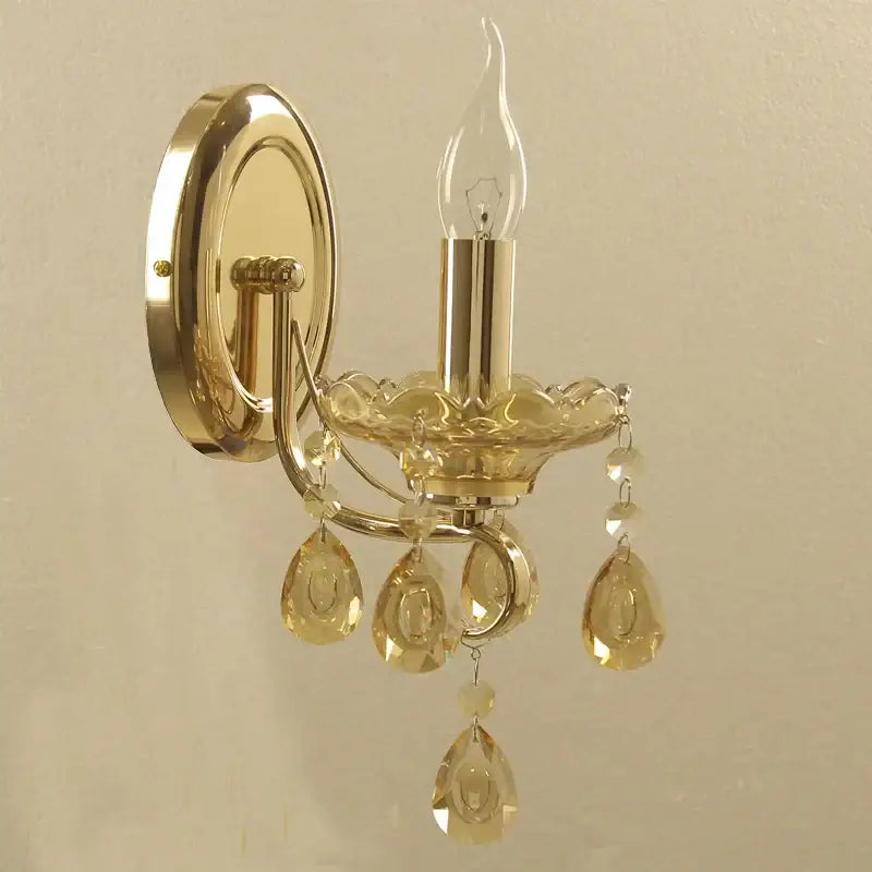 Luxury gold crystal wall sconce with amber teardrop pendants and clear candle-style bulb by decorbites crystal chandeliers