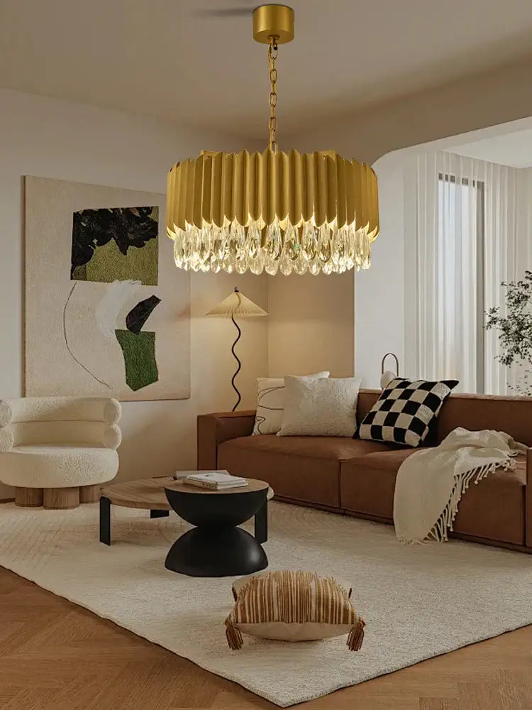 Luxury gold-toned pendant lights with a fluted cylindrical body and decorbites crystal water droplet accents for dining room decor