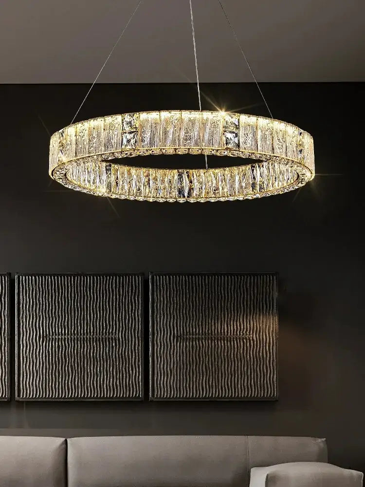 Luxury gold decorbites crystal glass chandelier with gold-toned frame and faceted prisms for living room lighting