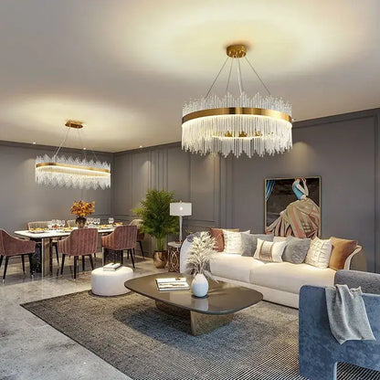 A luxury gold decorbites crystal led chandelier with a circular frame and cascading clear crystal strands for dining rooms
