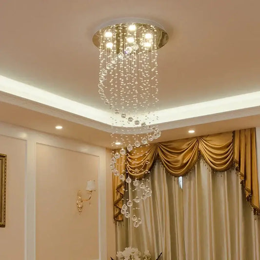 A circular living space decorbites k9 crystal chandelier with a gold metallic frame and cascading crystal beads