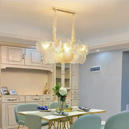 Luxury gold glass shell ceiling pendant light featuring a delicate translucent glass chandelier with golden frame and chains
