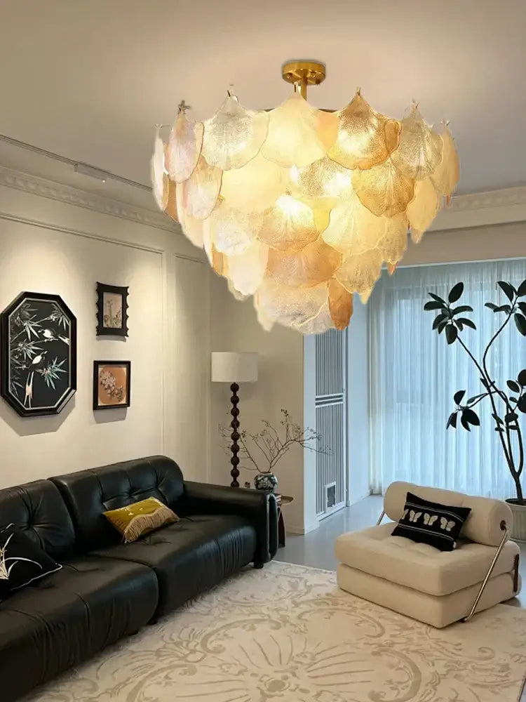 Luxury gold glass shell ceiling pendant light with translucent layered petals hanging from a brass fixture