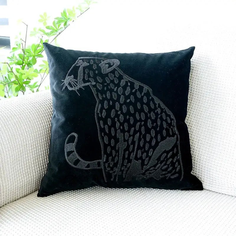 Black velvet pillow case with intricately embroidered decorbites gold leopard design in dark gray thread for luxury decor