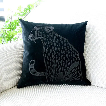 Black velvet pillow case with intricately embroidered decorbites gold leopard design in dark gray thread for luxury decor
