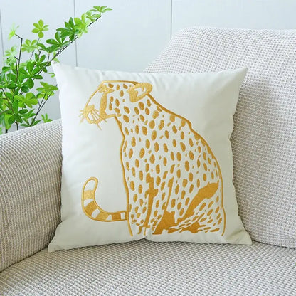 White velvet pillow case featuring an embroidered gold leopard design for luxury decorbites gold leopard living room decor