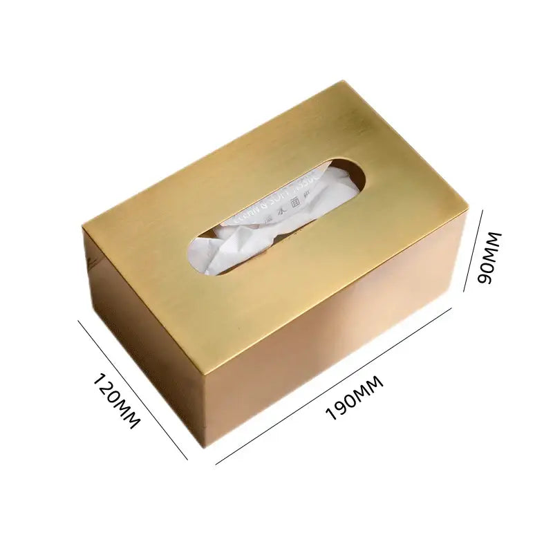 Luxury gold metal tissue box with sleek metallic finish and oval cutout for living room storage with deer figurine
