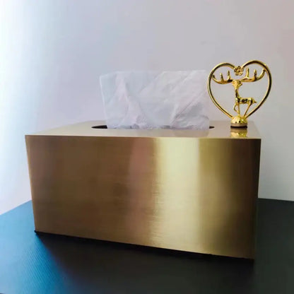 Luxury gold metal tissue box with polished finish and ornamental golden deer figurine in a heart-shaped frame