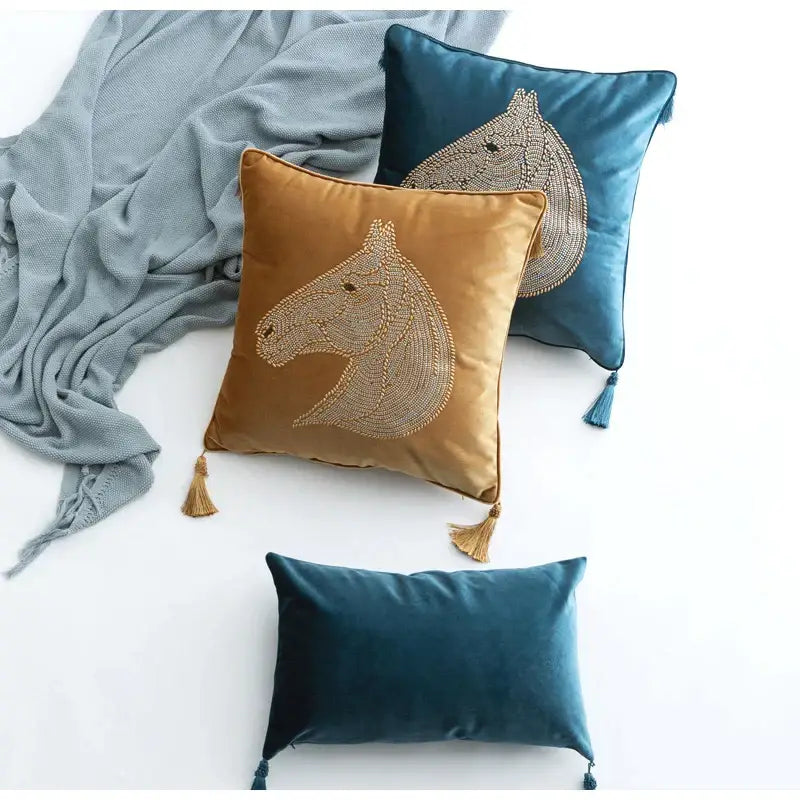 Luxury decorbites gold rhinestone velvet throw pillows in gold and teal with embroidered horse head and tassels