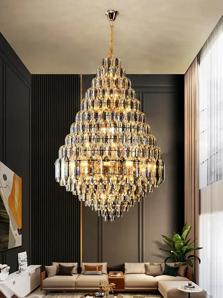 Luxury gold tiered crystal pendant chandelier with faceted clear crystals by Decorbites ideal for dining room light decor
