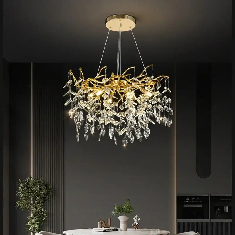 Luxury golden branch ceiling crystal chandelier featuring gold-toned metalwork and dangling crystal leaves for dining room decorbites golden branch