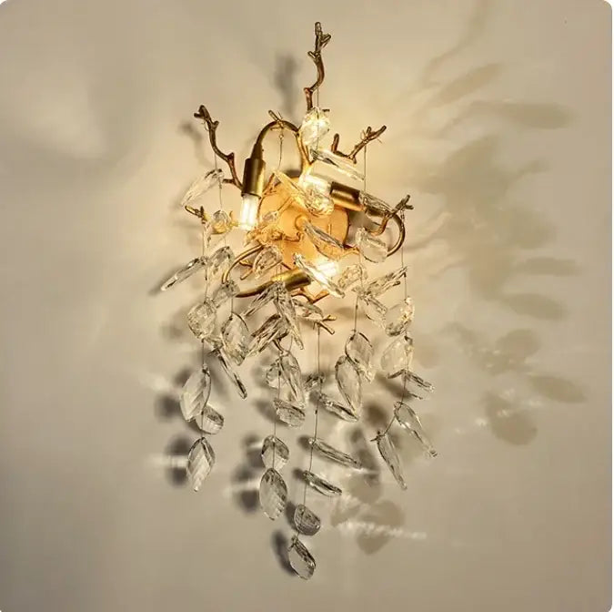 Gold-toned wall sconce with crystal leaf and branch accents for decorbites golden branch ceiling luxury lighting