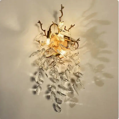 Gold-toned wall sconce with crystal leaf and branch accents for decorbites golden branch ceiling luxury lighting