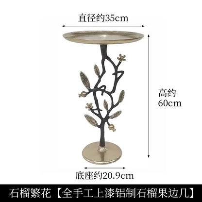 Luxury golden brass bird tree side table with an antique silver finish and decorative leaves pomegranates base by decorbites brass bird