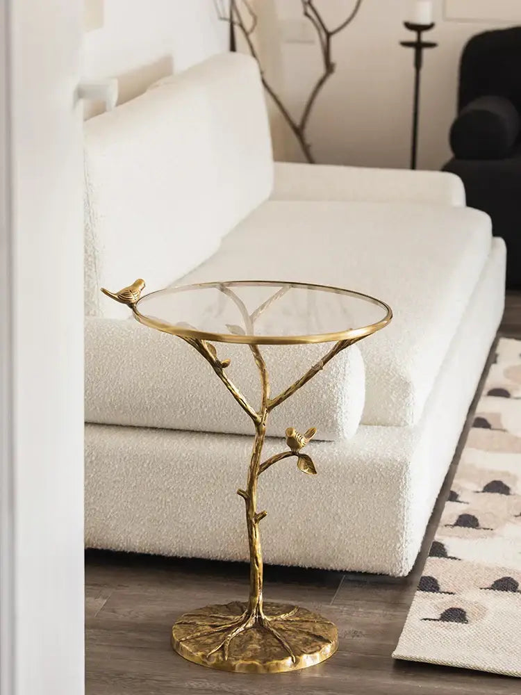 Luxury golden brass bird tree side table with glass top and intricate bird branch legs by decorbites brass bird decor