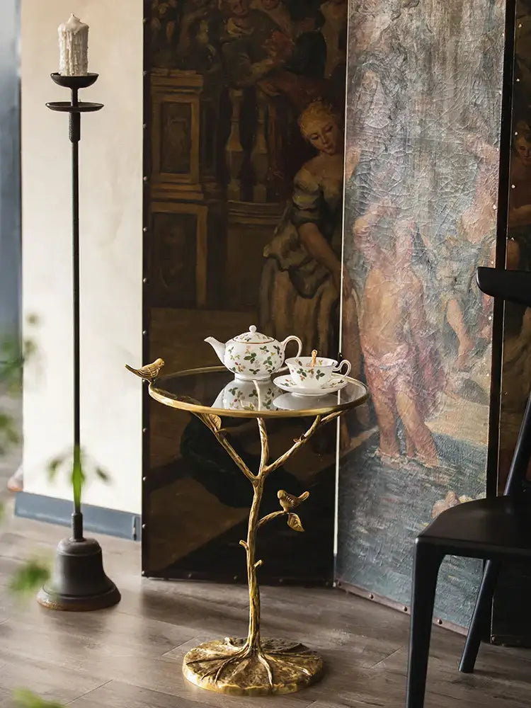 Luxury golden brass bird tree side table with glass top and decorative birds for living room decorbites brass bird design