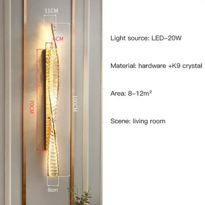 A sleek gold-toned wall sconce with twisted design and k9 crystal elements from decorbites crystal led collection