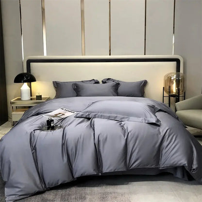 Luxury gray egyptian cotton bedding set with satin duvet cover and matching pillows arranged on a modern bed