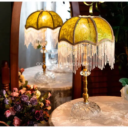 Elegant gold-toned table lamp with yellow patterned glass shade and white beaded fringe for decorbites green velvet tasseling decor